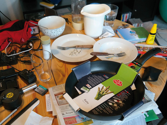 Clutter all over a kitchen table