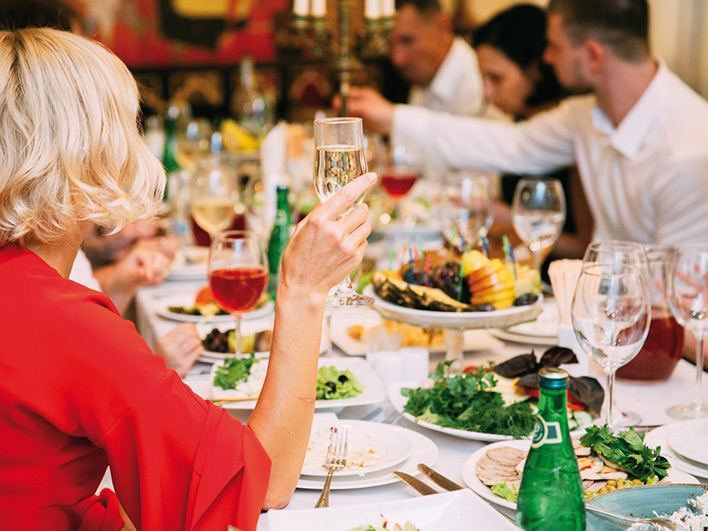 People making a toast whilst dining