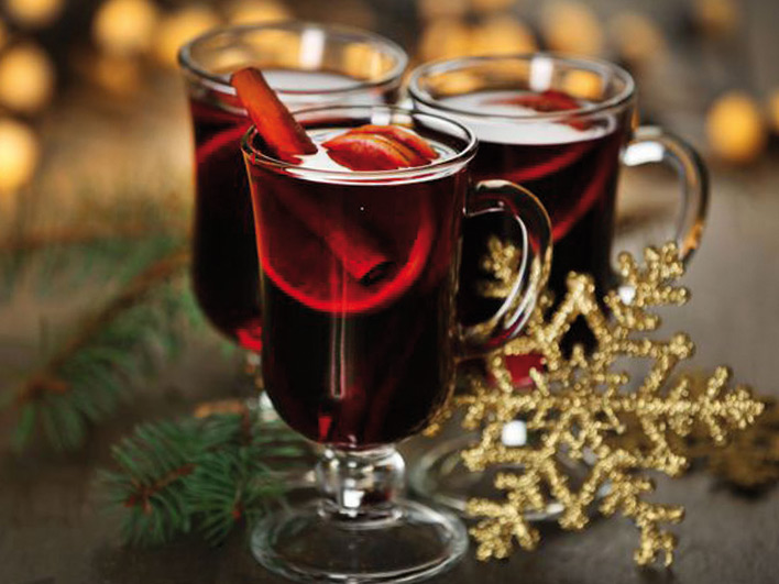 Three glasses of mulled wine with snowflake christmas decoration